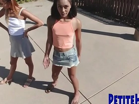 Three petite teenagers engage in a hardcore session